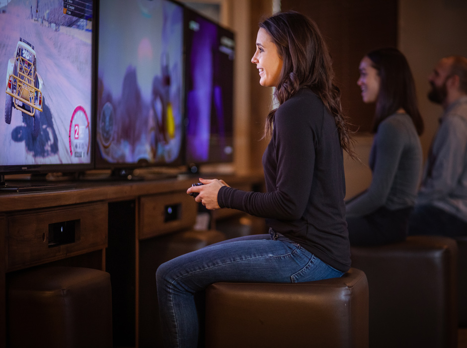 3 guests enjoying the complimentary Game Room at Holiday Inn West Yellowstone