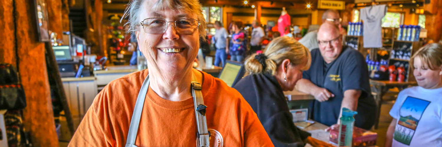 Happy employee inside Yellowstone General Stores
