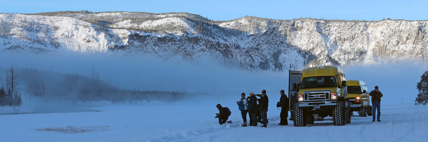Yellowstone Vacations snowcoach buses during the winter