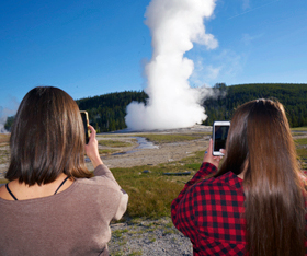 Yellowstone visitors at Old Faithful Geyser