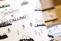 The Mountains are Calling pillow available for purchase at Yellowstone General Stores
