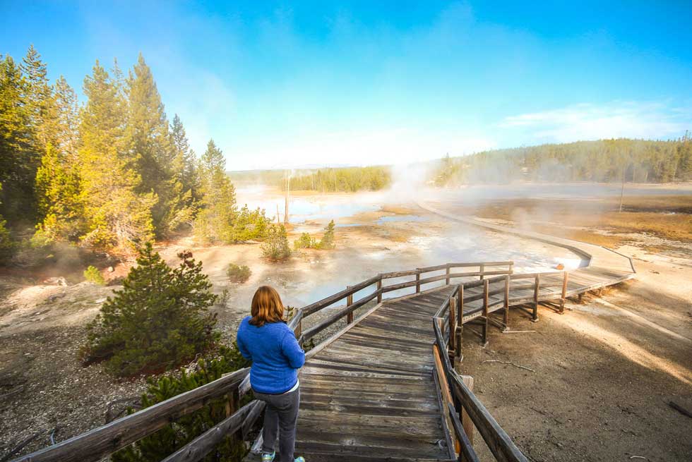 Walking on trail towards a Yellowstone Geyser