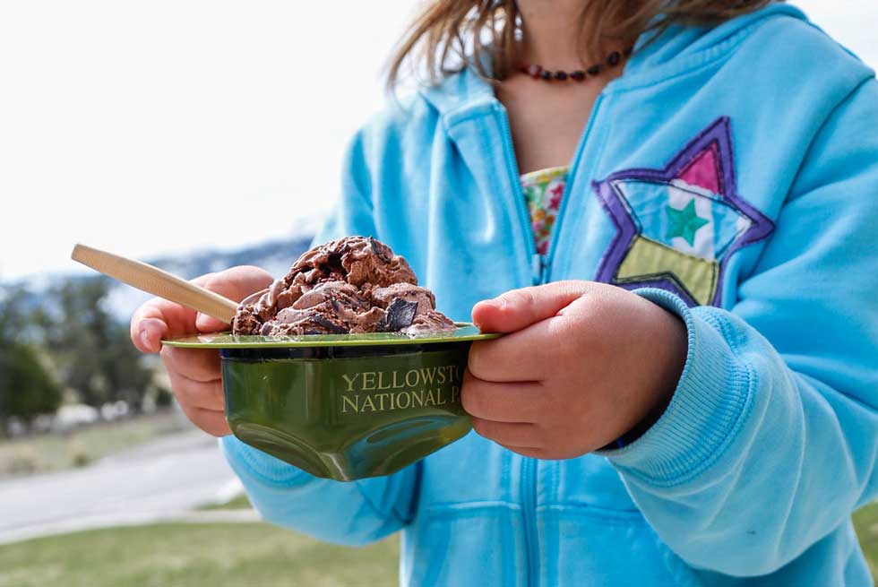 Child holding a rangers hat filled with ice cream
