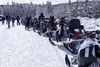 A line of snowmobiles during a tour of Yellowstone National Park