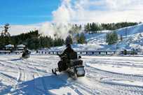 Yellowstone snowmobile rider at Mud Volcano